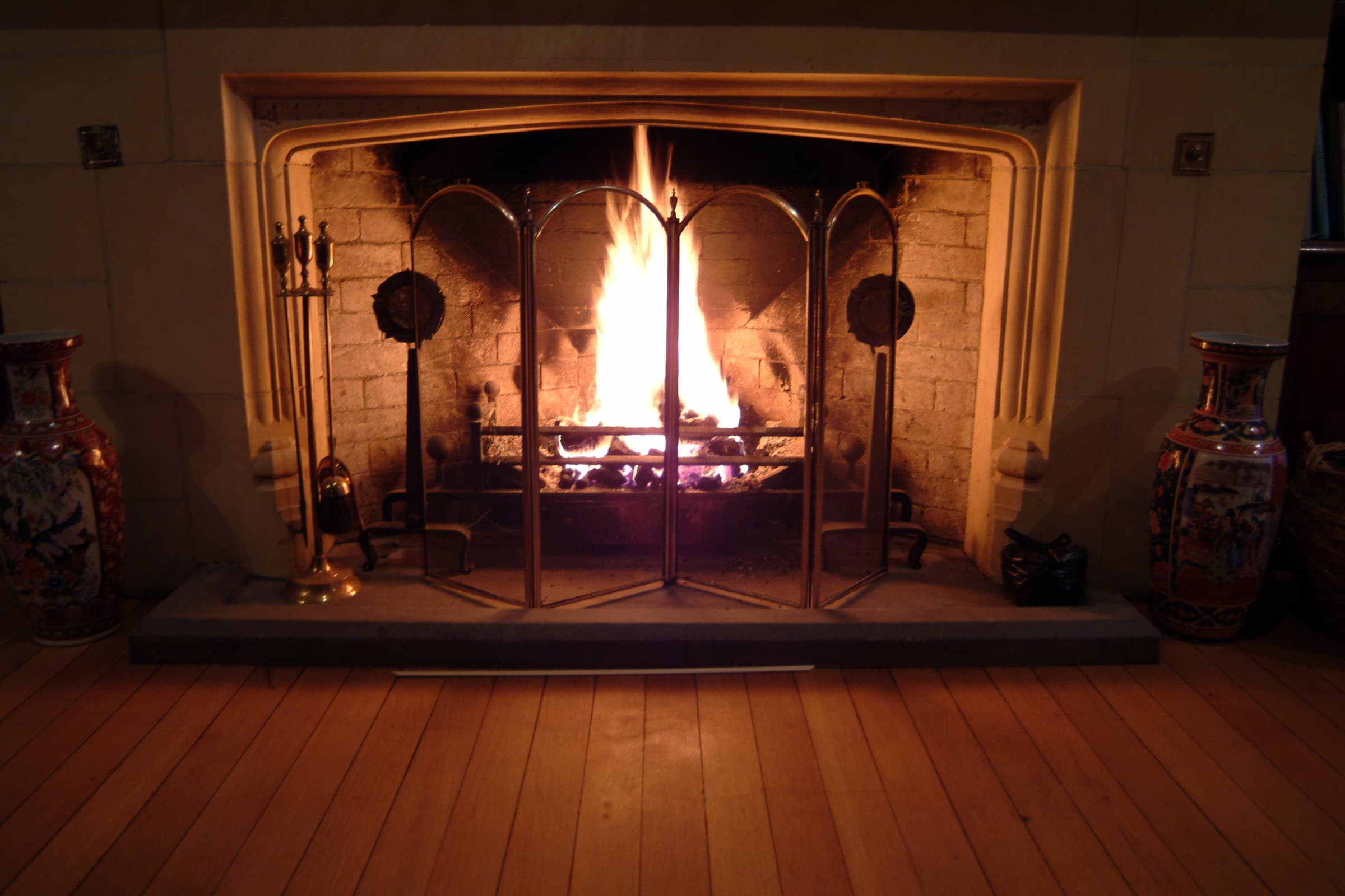 Traditional fireplace with ornate mantlepiece at Honiley Hall